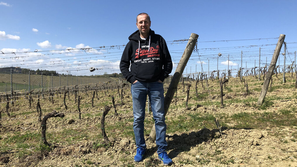 Roberto Mascarin standing in one of his vineyards in Emilia Romagna